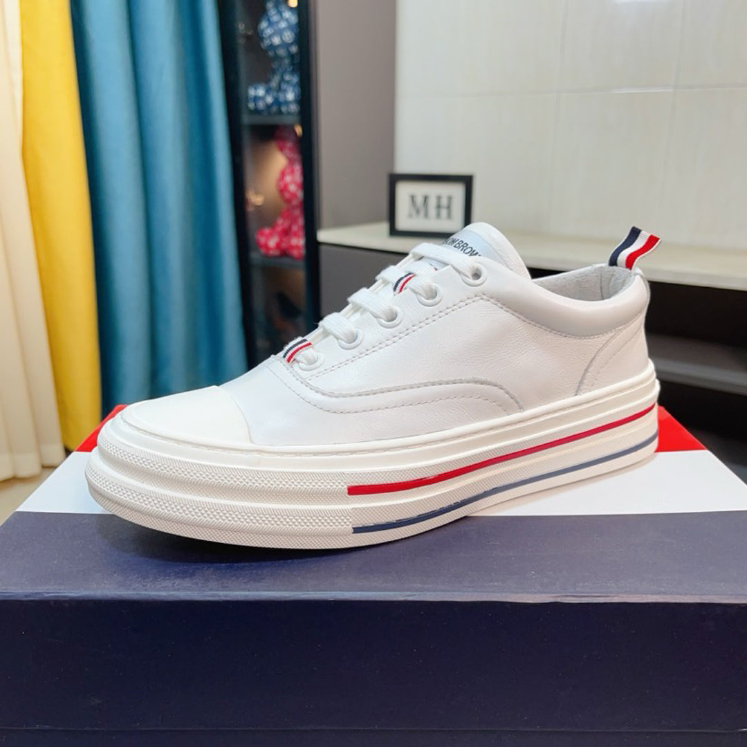 Thom BrowneClassic Premium Leather Sneakers with Grosgrain Buckle - Timeless Design
