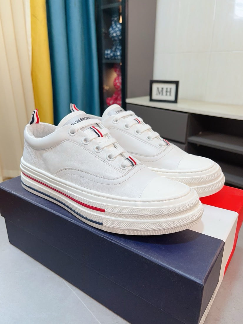 Thom BrowneClassic Premium Leather Sneakers with Grosgrain Buckle - Timeless Design
