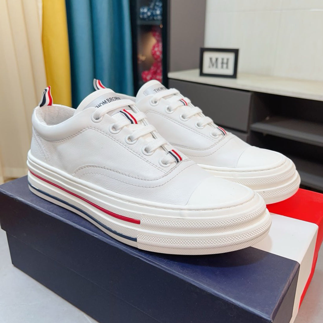 Thom BrowneClassic Premium Leather Sneakers with Grosgrain Buckle - Timeless Design