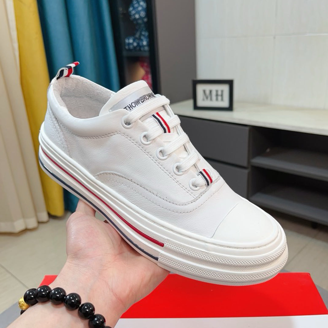 Thom BrowneClassic Premium Leather Sneakers with Grosgrain Buckle - Timeless Design