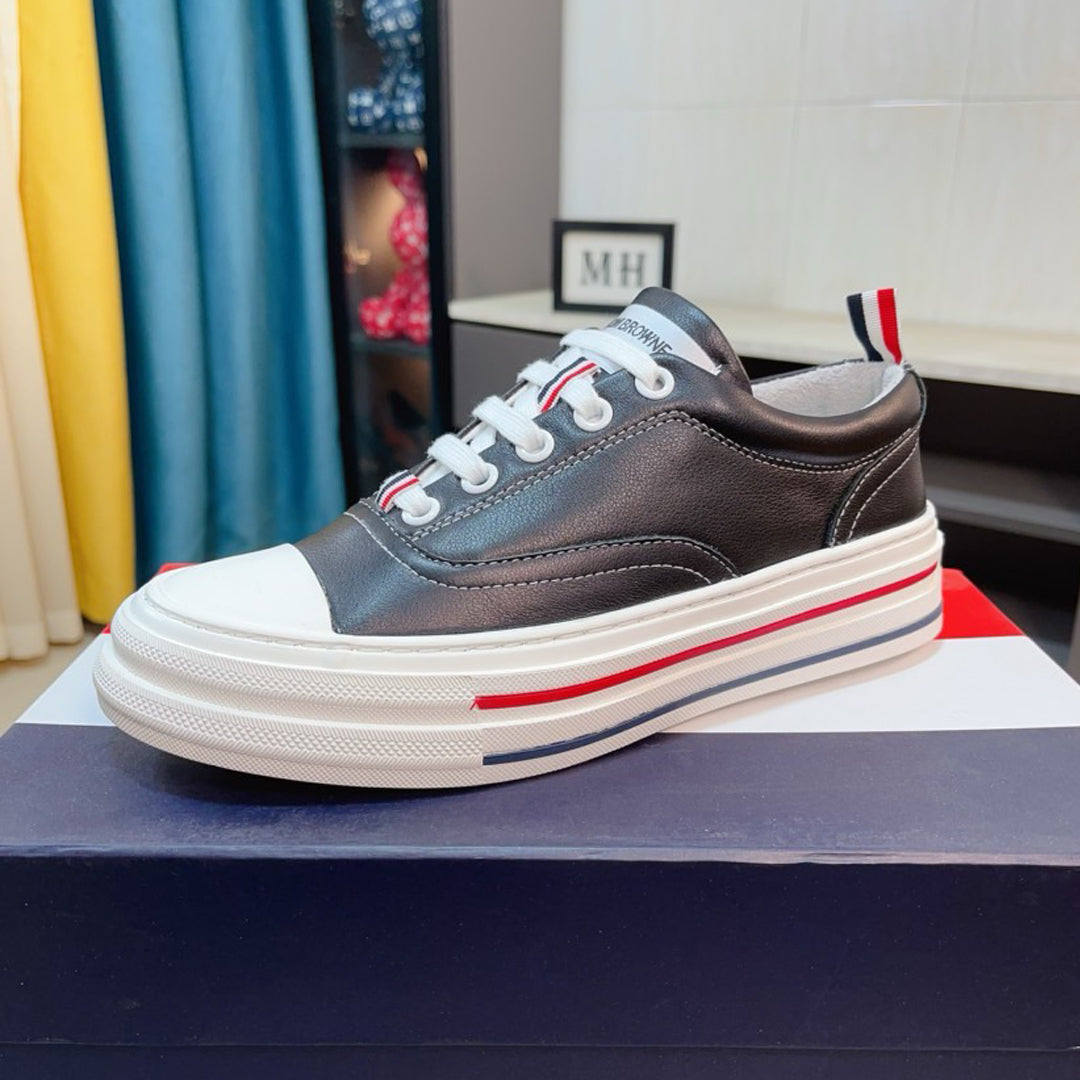 Thom BrowneClassic Premium Leather Sneakers with Grosgrain Buckle - Timeless Design